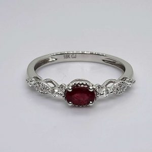 18kt White Gold East West set Oval Cut Ruby and Round Brilliant Cut Diamond Vintage Inspired Ring