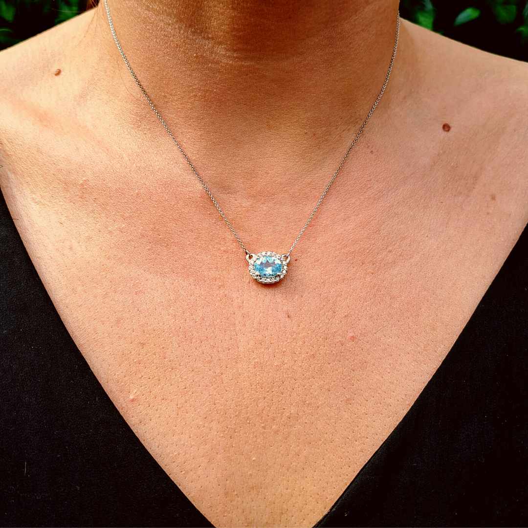 Oval Cut Sky Blue Topaz and Diamond Halo