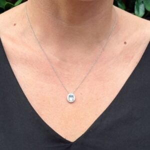 Sky Blue Topaz and diamond halo pendant