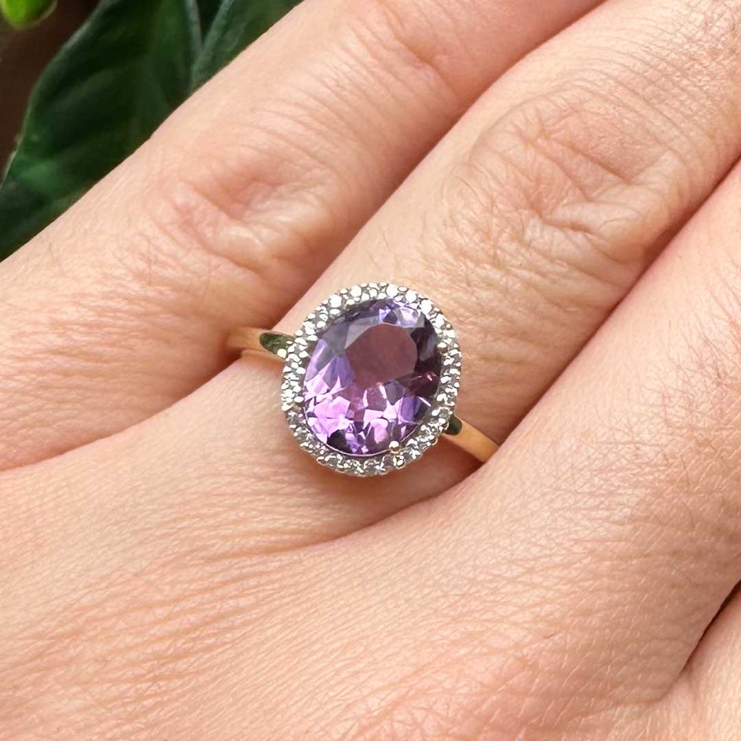 9kt Yellow Gold Ring with Oval Cut Amethyst and Diamond Halo