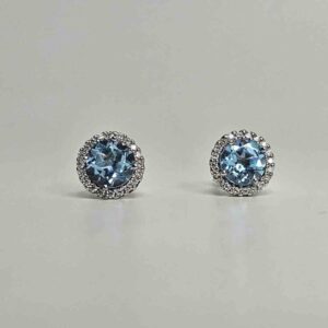 9kt White Gold Earrings with 6x6mm Round Cut London Blue Topaz and 0.20ct H Colour SI Clarity Round Brilliant Cut Diamond Halo