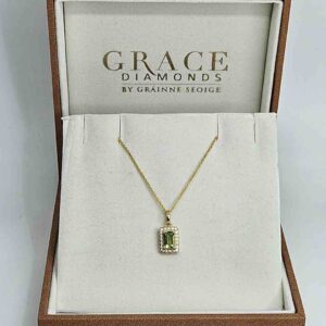 9kt Yellow Gold Pendant with Emerald Cut Peridot and Diamond Halo