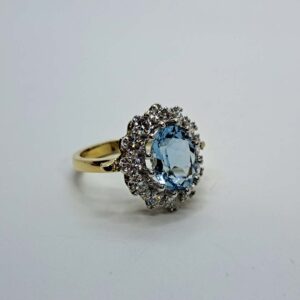 Platinum and 18kt Yellow Gold Ring with Round Cut Aquamarine and Diamond Halo