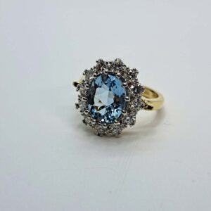 Platinum and 18kt Yellow Gold Ring with Round Cut Aquamarine and Diamond Halo