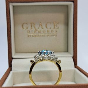 Platinum and 18kt Yellow Gold Ring with Round Cut Aquamarine and Diamond Halo