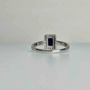 9kt White Gold Ring with Emerald Cut Blue Sapphire and Diamond Halo