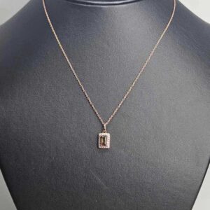 9kt Rose Gold Pendant with Emerald Cut Peridot and Diamond Halo