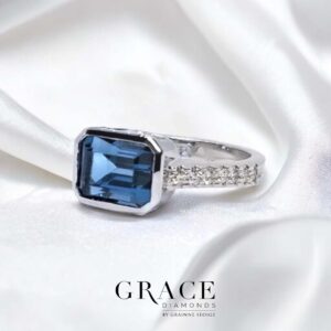 9kt White Gold Ring with East West Set London Blue Topaz and Diamond Band