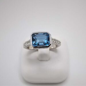 9kt White Gold Ring with East West Set London Blue Topaz and Diamond Band