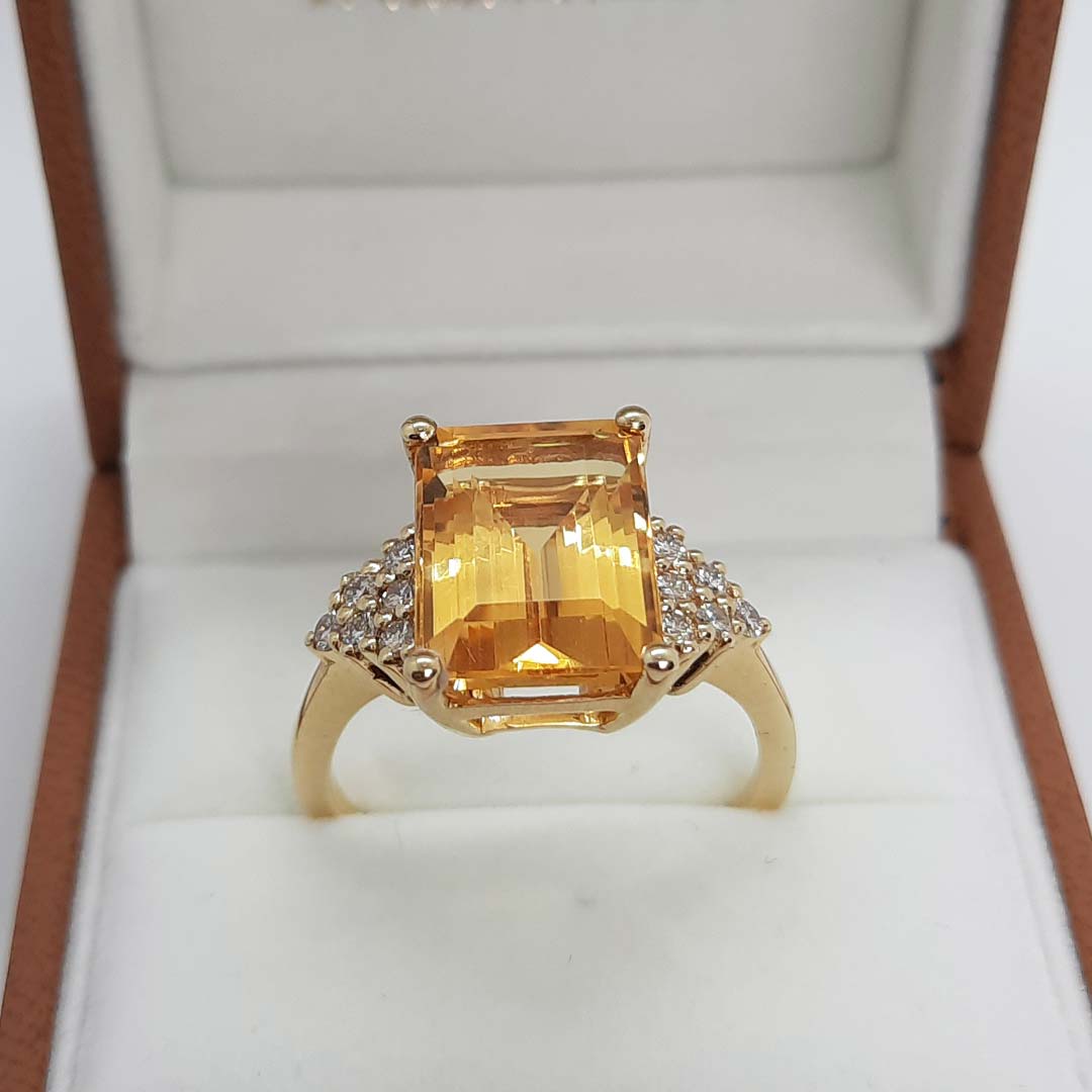 18kt Yellow Gold Ring with Emerald Cut Citrine and Trilliant Cut Diamond Sidestones