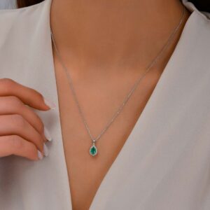 18kt White Gold Pendant with Pear Cut Emerald and Diamond Halo