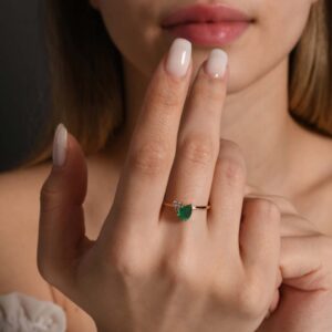 18kt Yellow Gold Ring with 7x5mm Pear Cut Emerald and 3 Round Brilliant Diamonds