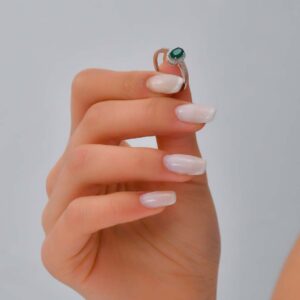 18kt White Gold Ring with Oval Cut Emerald and Diamond Halo