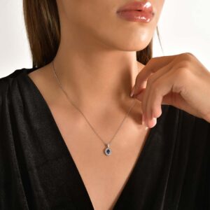 18kt White Gold Pendant with Oval Cut Blue Sapphire and Double Diamond Halo