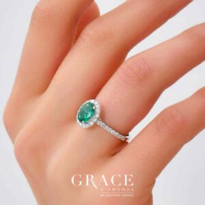 18kt White Gold Ring with 8x6mm Oval Cut Emerald and Round Brilliant Cut Diamond Halo and Band