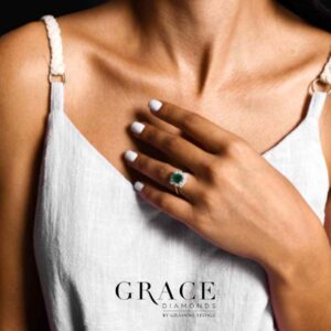 18kt White Gold Ring with 7x5mm Emerald Cut Emerald and Vintage Inspired Double Diamond Halo