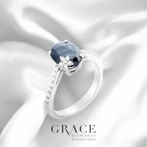 18kt White Gold Ring with Oval Cut Blue Sapphire and Diamond Floral Motif
