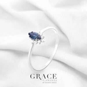 18kt White Gold Ring with 6x3mm Marquise Cut Blue Sapphire and Half Halo of Diamonds