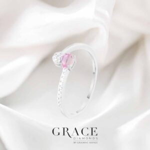 18kt White Gold Ring with 4x3mm Oval Cut Pink Sapphire and Round Brilliant Cut Diamonds