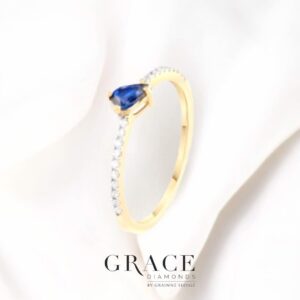18kt Yellow Gold Ring with Pear Cut Blue Sapphire and Round Brilliant Cut Diamonds