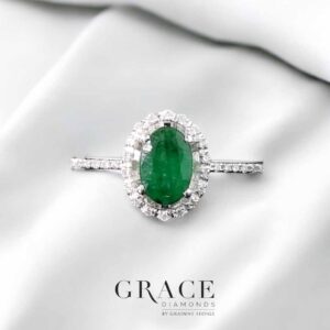 18kt White Gold Ring with Oval Cut Emerald and Diamond Halo