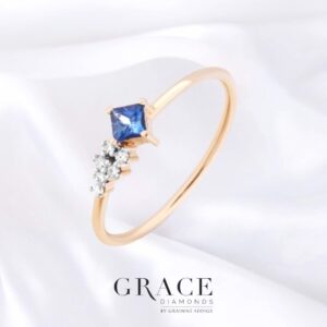 18kt Yellow Gold Ring with Princess Cut Blue Sapphire and Round Brilliant Cut Diamonds
